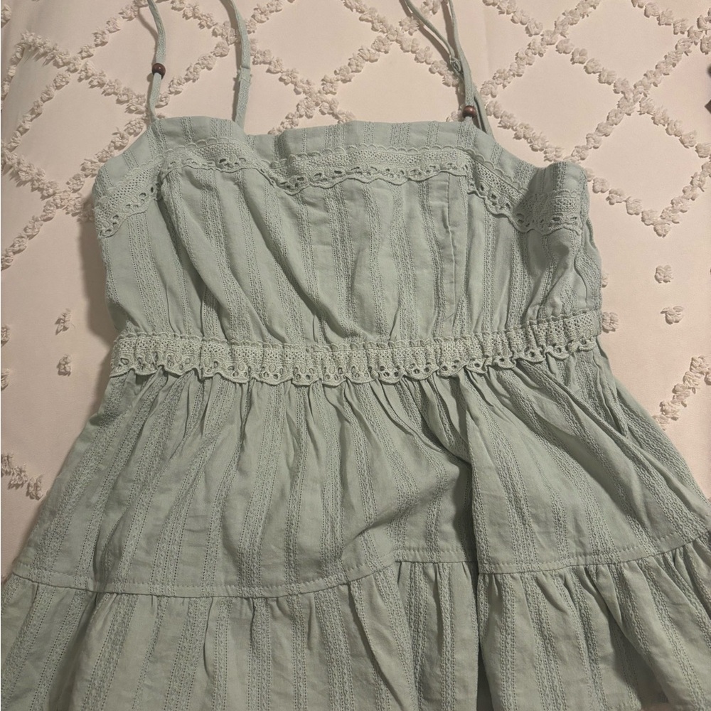 Light green top, size small. Brand new, never worn.